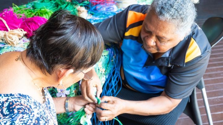 Cultural Weaver and GTCC Artist Flora Warria teaching Heidi Stuart, Workshop Participant