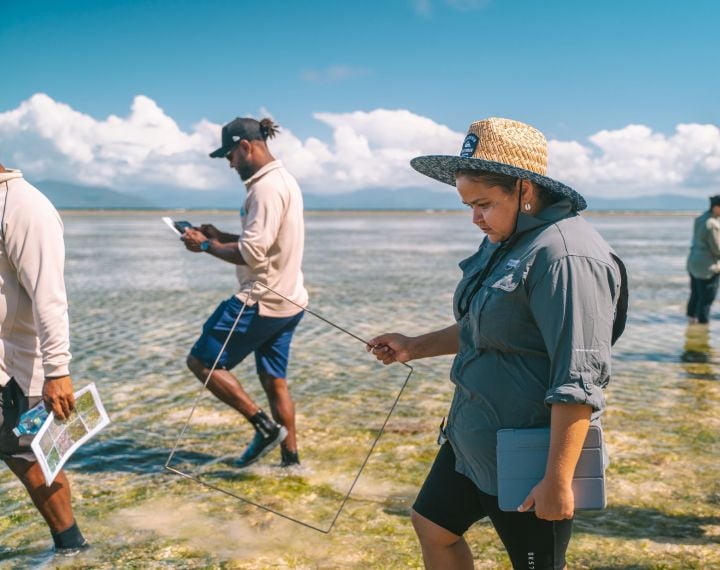 Marine Scientist wading through Ocean