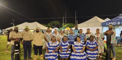 TSRA Rangers with Mabuaig Island singers and composer Lency Bani on Ken Brown Oval on Thursday Island in the Torres Strait region for the Winds of Zenadth Cultural Festival.
