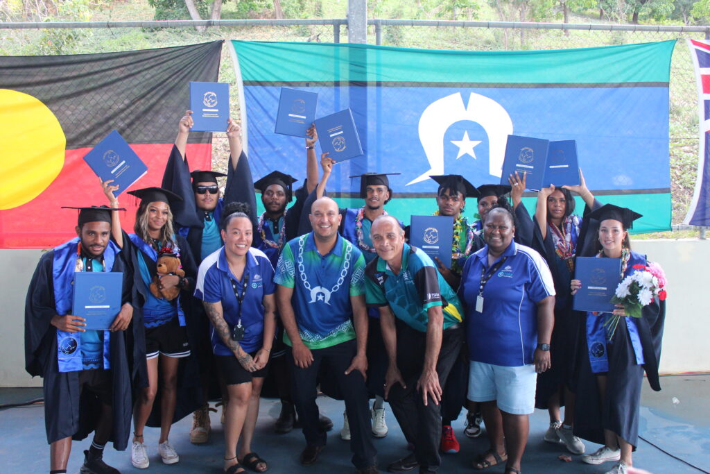 Nine Tagai State College students with Torres Strait Regional Authority staff celebrate their graduation on Thursday Island in the Torres Strait region.