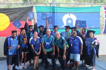 Nine Tagai State College students with Torres Strait Regional Authority staff celebrate their graduation on Thursday Island in the Torres Strait region.