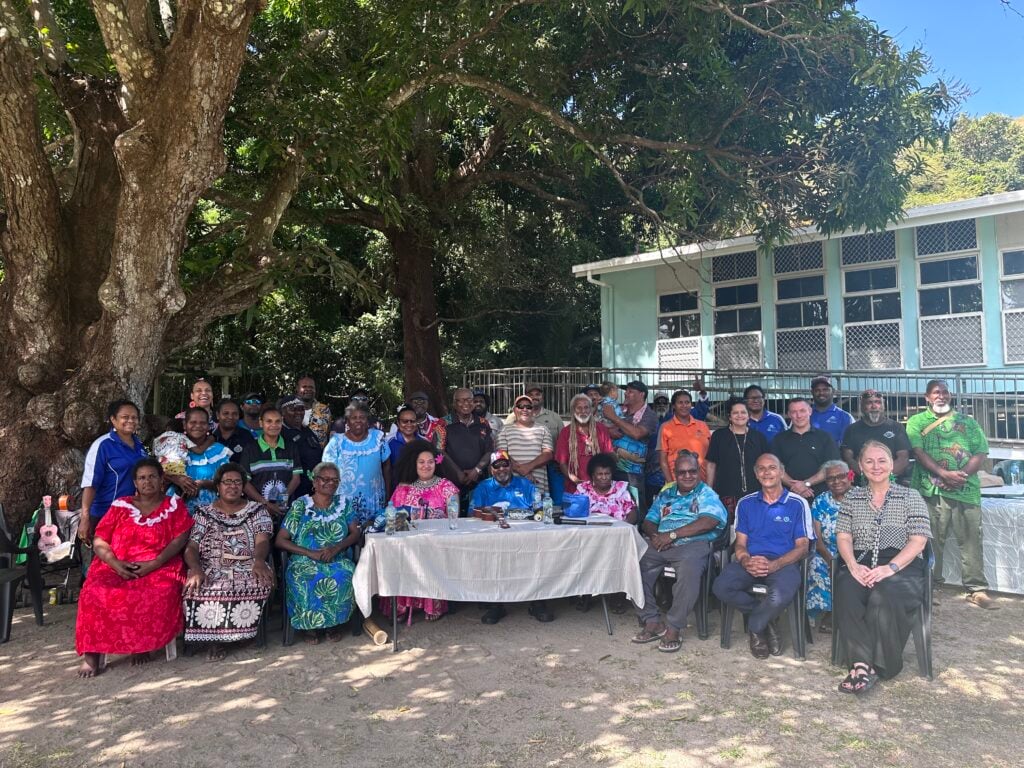 Community and executives gather on Mer Island in the Torres Strait