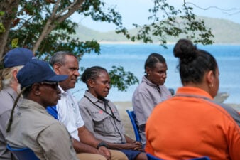 Yarning circle: TSRA Chairperson George Nona (middle) with rangers